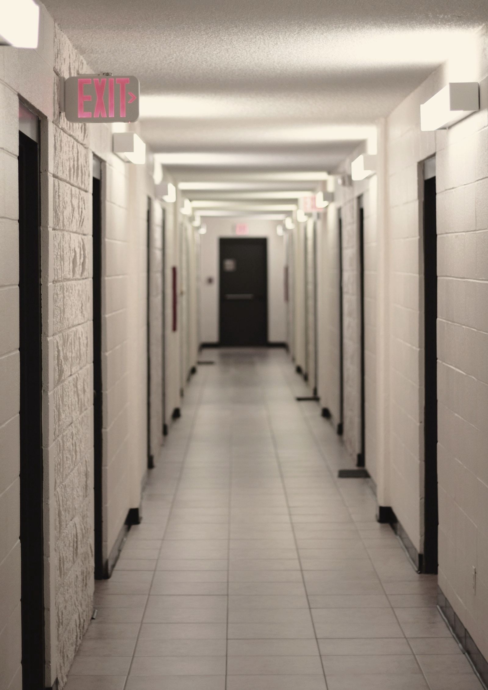 A residence hallway lined with doors